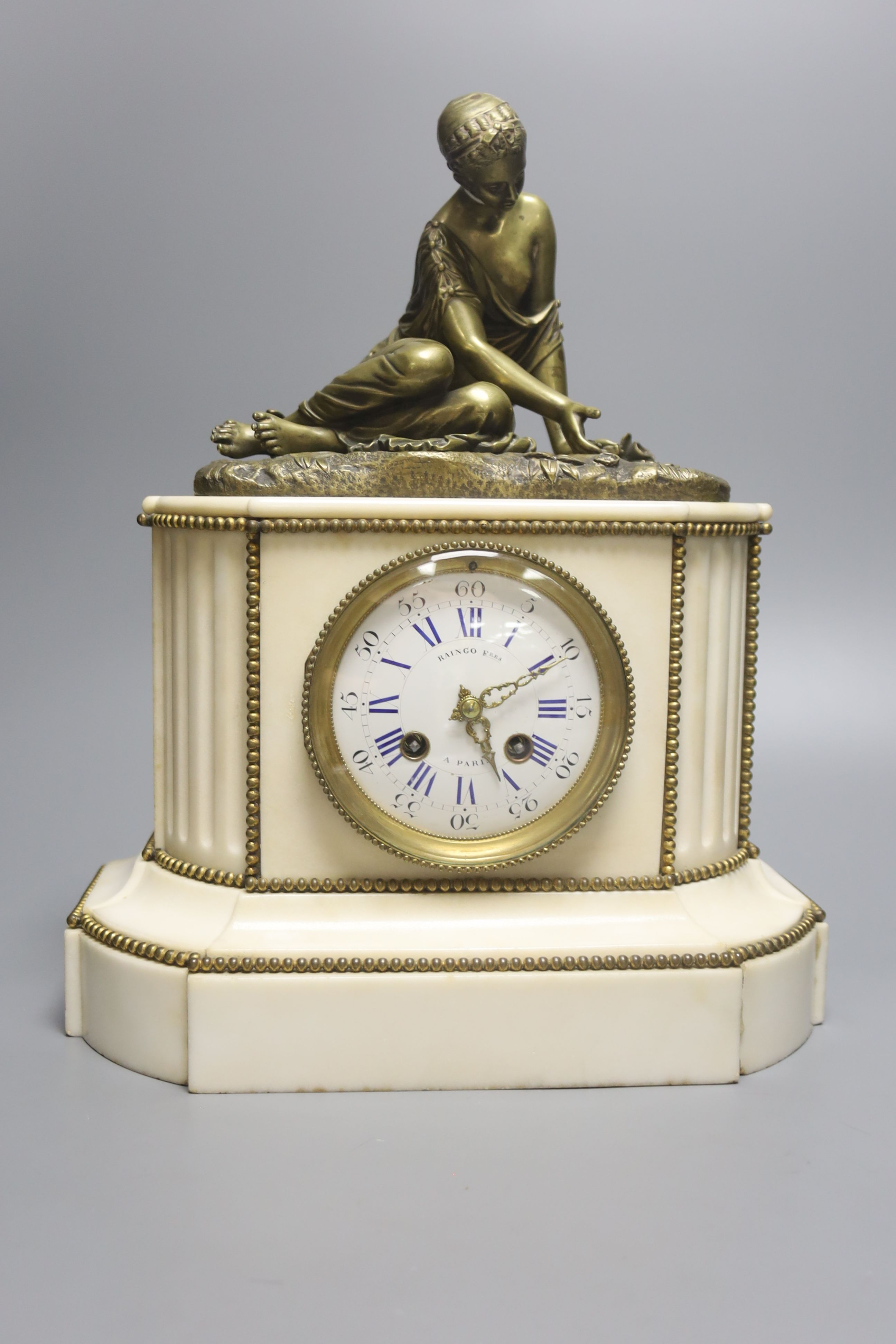 A 19th century French bronze and marble figural mantel clock, height 35cm